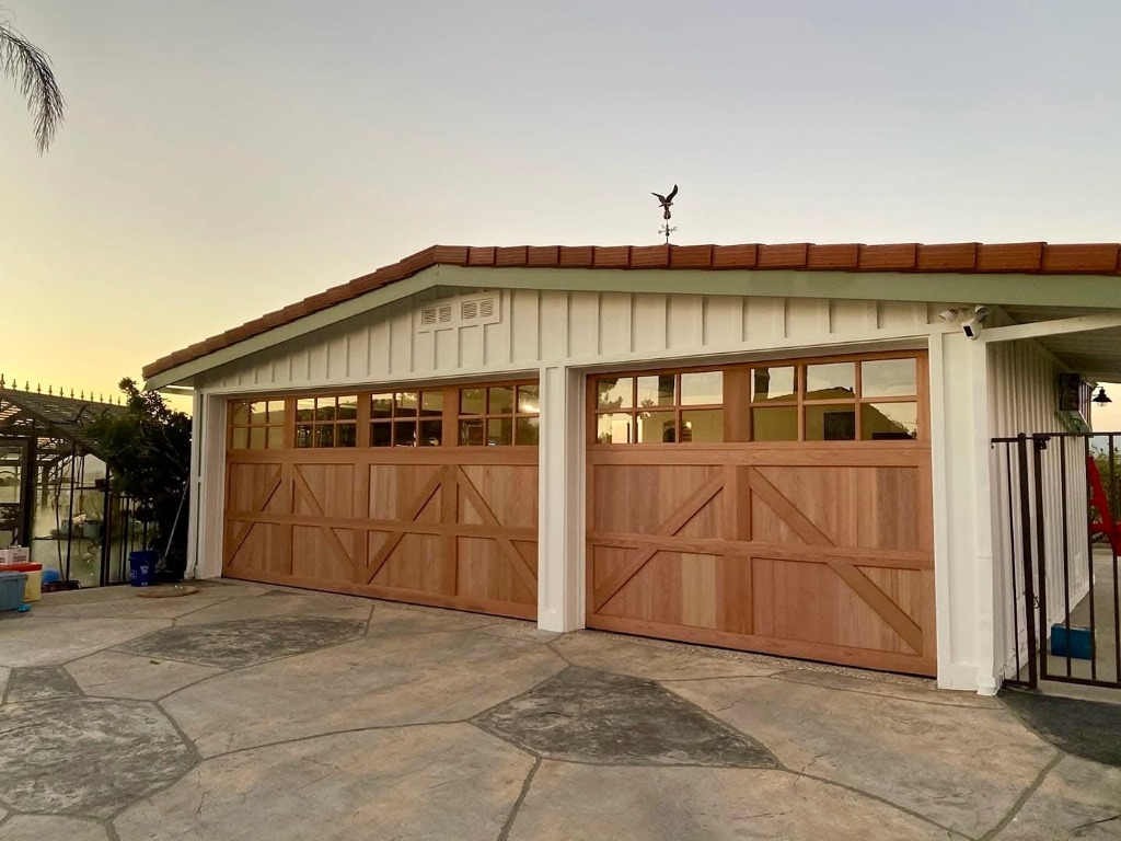 Double wood carriage-style garage doors in natural cedar on Central Oregon residence